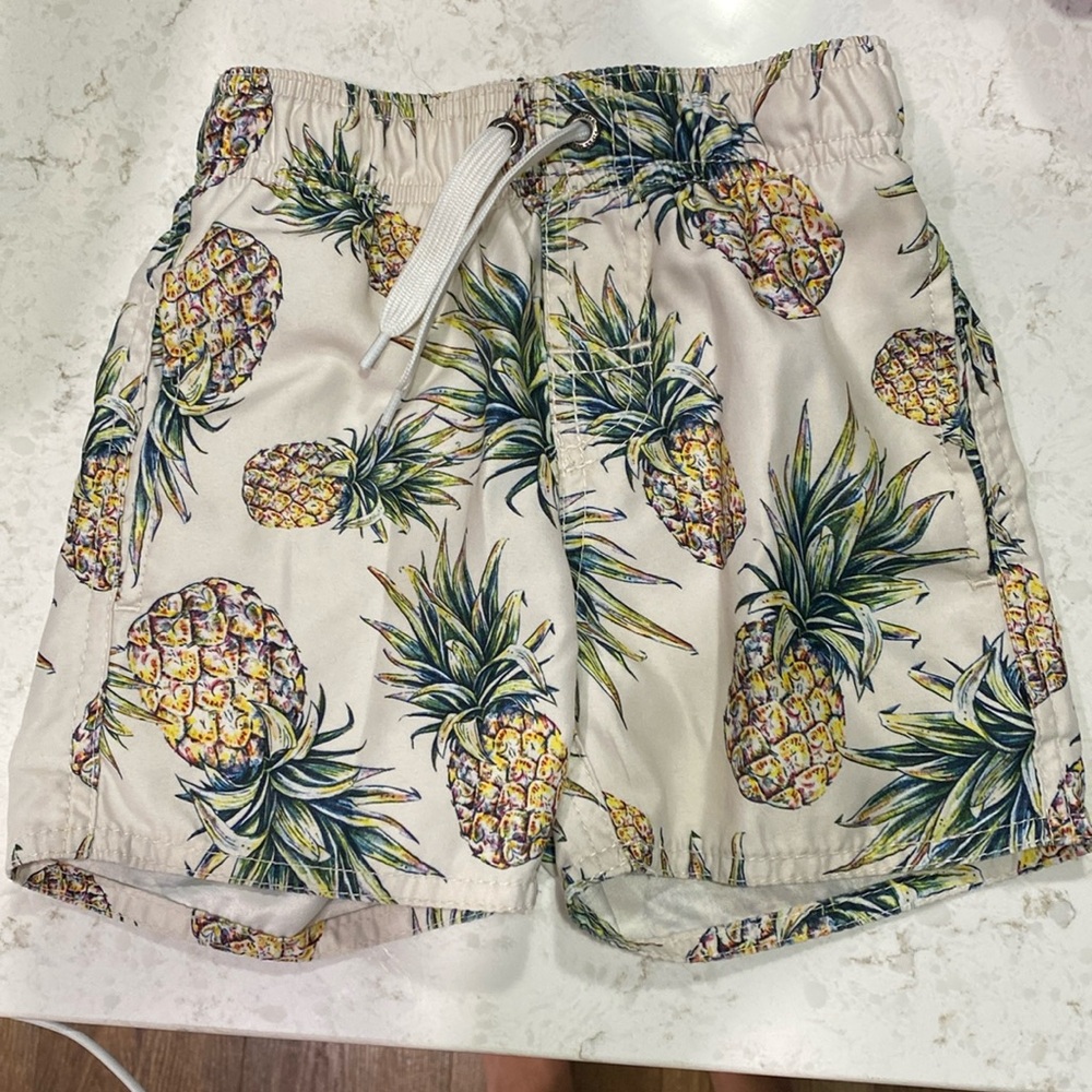 First Wave pineapple swim trunks